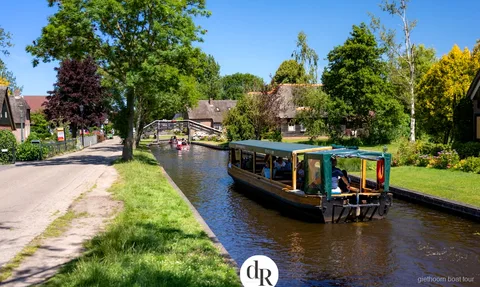 Open reed-lined waterway inside Weerribben-Wieden National Park seen on the Giethoorn boat tour