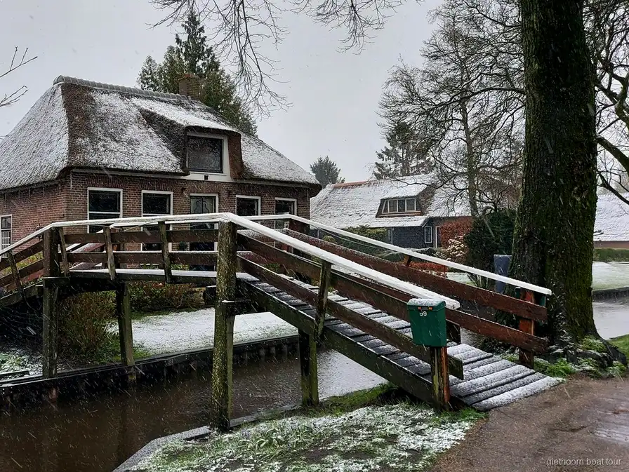 Canal boat ride through Giethoorn on the small group tour